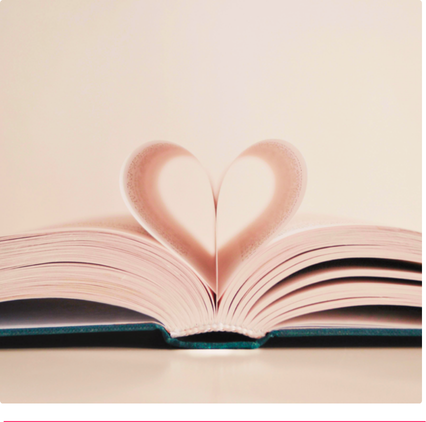 Open book with heart-shaped pages