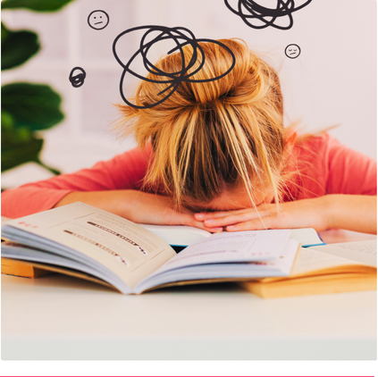 Woman experiencing overwhelm while working through open books