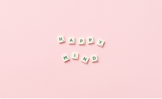 Happy Mind letter tiles on a pink background