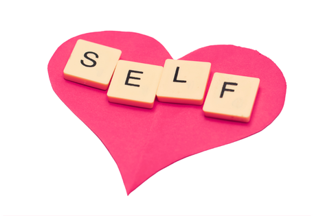 SELF letters on a pink heart