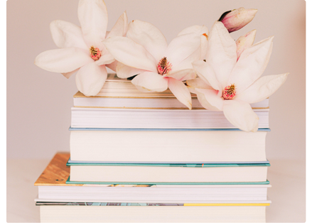 Flowers resting on a stack of books